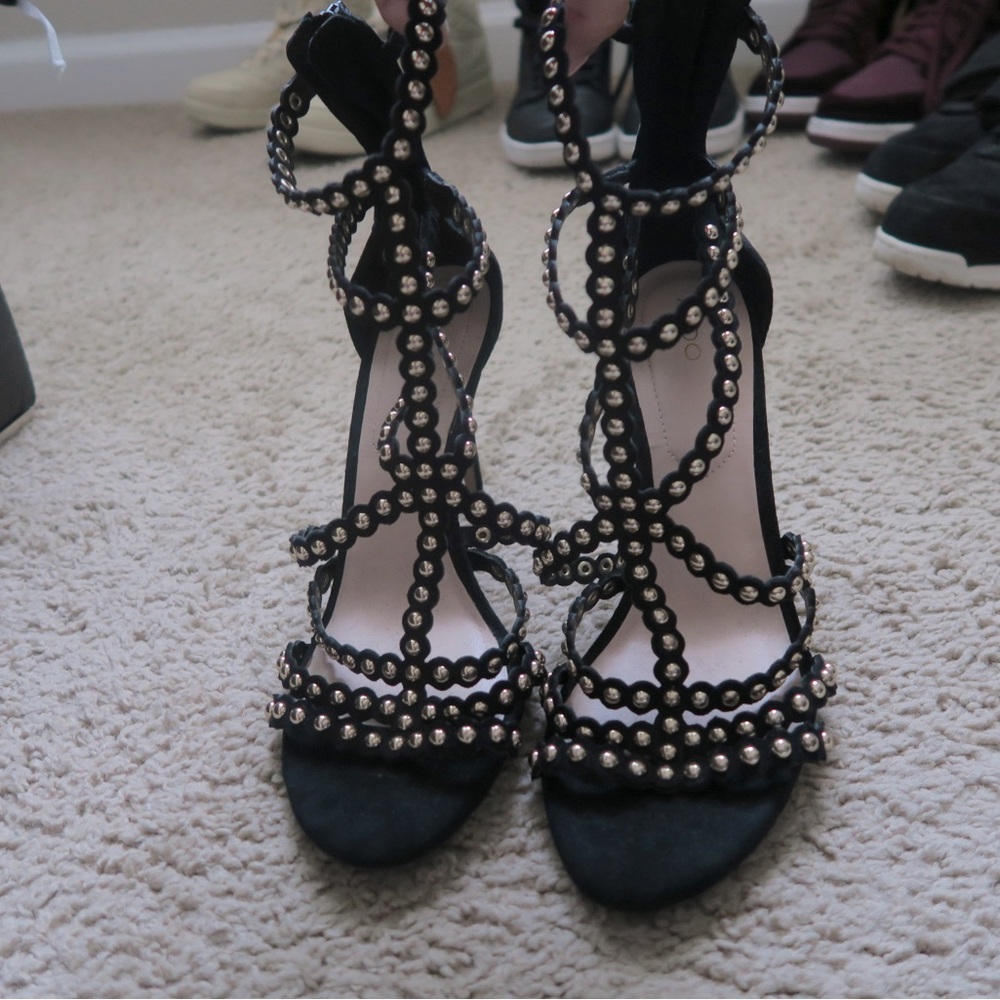 Black heels, gold accents